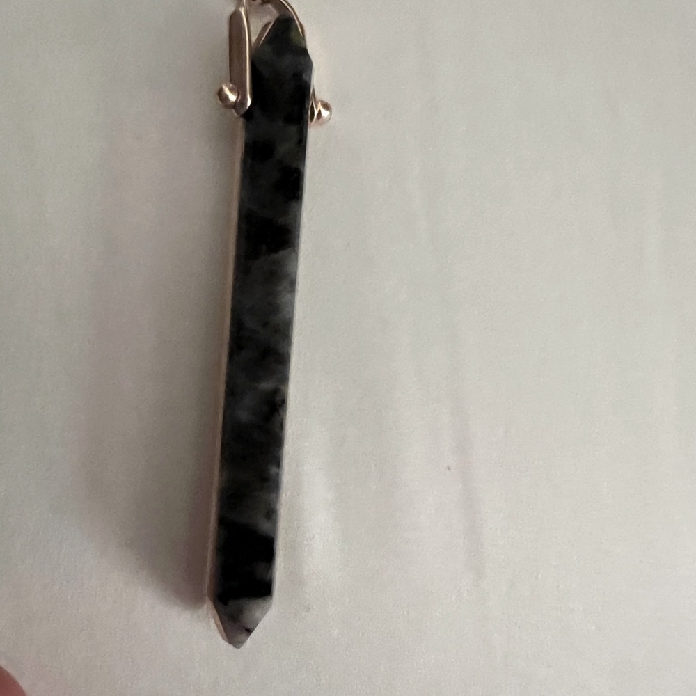 Rebel rose gold necklace with dark stone